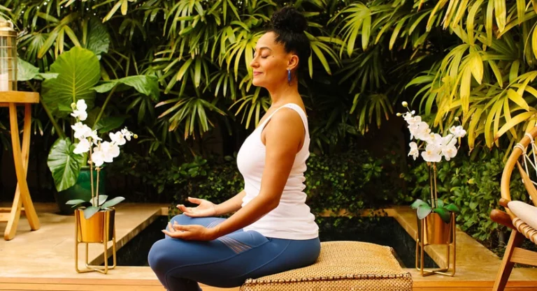 Actress Tracee Ellis Ross practices yoga in a tropical setting