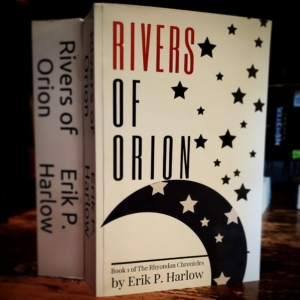 Rivers of Orion by Erik Harlow book on a wood table